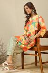 Label Nitika_Orange Cotton Split V-neck Floral Print Kurta And Checkered Pant Set _at_Aza_Fashions