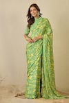 Buy_Label Nitika_Green Satin, Georgette Emerald Striped Saree With Unstitched Blouse Piece _at_Aza_Fashions