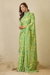 Label Nitika_Green Satin, Georgette Emerald Striped Saree With Unstitched Blouse Piece _Online_at_Aza_Fashions