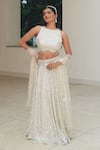 Buy_Pooja Bagaria_Silver Silk Sequins, Embroidery Round Neck Mesh Lehenga Set _at_Aza_Fashions