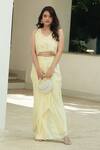 Shop_Pooja Bagaria_Yellow Organza, Satin Fringe, Embroidery Pastel Monotone Draped Skirt Set _Online_at_Aza_Fashions