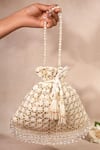 Buy_House Of Kosha_Ivory Embroidery, Sequins, Tassels Kundan Embellished Potli Bag _at_Aza_Fashions