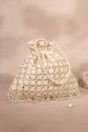 Shop_House Of Kosha_Ivory Embroidery, Sequins, Tassels Kundan Embellished Potli Bag _at_Aza_Fashions