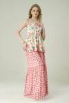Surabhi Arya_Ivory Muslin Off-shoulder, Bandeau Neck Floral Peplum Top And Skirt Set _Online_at_Aza_Fashions