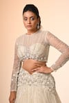 Couture By Niharika_Ivory Net Embroidery, Sequins Round Neck Designer Lehenga Set _at_Aza_Fashions