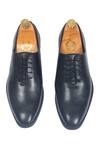 Shop_Domani_Black Classic Wholecut Derby Shoes _at_Aza_Fashions