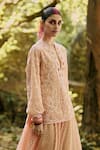 Buy_Surily G_Peach Lace Sequins, Cut Work Round Neck Top With Jaal Embroidery _at_Aza_Fashions