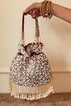 Buy_The Tan Clan_Red Pearls Rimsha Potli Bag With Tassels _at_Aza_Fashions