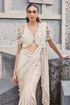 Shop_Mehul Gupta_Ivory Satin Pearls, Tassels V-neck Hand Embroidered Pre-draped Saree Set _Online_at_Aza_Fashions