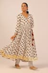Palak & Mehak_Cream Chanderi Zari, Tassels V-neck Floral Print Anarkali Set _Online_at_Aza_Fashions
