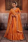 Buy_Kapda Dori_Rust Mirrors, Sequins, Pearls Round Neck Orange Banarsi Silk Lehenga Set _at_Aza_Fashions