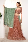 Anita Kanwal_Rust Georgette Sequins, Embroidery V-neck Orange Lehenga Set _at_Aza_Fashions