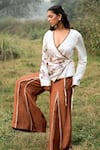 Buy_Kushani_Ivory Satin, Linen Embroidery V-neck Wrap Top And Mocha Brown Trousers _Online_at_Aza_Fashions