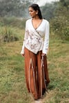 Shop_Kushani_Ivory Satin, Linen Embroidery V-neck Wrap Top And Mocha Brown Trousers _Online_at_Aza_Fashions