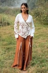 Buy_Kushani_Ivory Satin, Linen Embroidery V-neck Wrap Top And Mocha Brown Trousers _at_Aza_Fashions