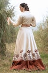 Shop_Kushani_Ivory Satin, Linen Tassels, Beads Round Neck Floral Serenity Lehenga Set _at_Aza_Fashions