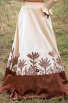 Shop_Kushani_Ivory Satin, Linen Tassels, Beads Round Neck Floral Serenity Lehenga Set _Online_at_Aza_Fashions