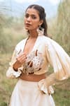 Shop_Kushani_Ivory Satin, Linen Tassels, Beads Round Neck Floral Serenity Lehenga Set 
