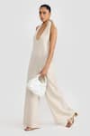 Buy_PERONA_Beige Linen Halter Neck Leilani Jumpsuit _Online_at_Aza_Fashions