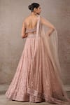 Shop_Tarun Tahiliani_Peach Tulle, Net Sequins Sweetheart Neck Embroidered Lehenga Set _at_Aza_Fashions