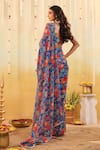 Shop_B'Infinite_Blue Georgette V-neck Carnival Bloom Embellished Draped Saree With Blouse _at_Aza_Fashions
