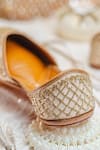 Shop_NR By Nidhi Rathi_Gold Gold-toned Leather Embroidered Juttis _Online_at_Aza_Fashions