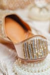 Shop_NR By Nidhi Rathi_Gold Gold-toned Embroidered Flat Juttis _Online_at_Aza_Fashions