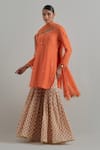 Buy_Ikshita Choudhary_Orange Chanderi, Cambric, Cotton Embroidery Block Printed Kurta Gharara Set _at_Aza_Fashions