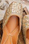 Shop_NR By Nidhi Rathi_Gold Handcrafted Embroidered Leather Juttis 