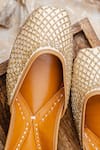 Shop_NR By Nidhi Rathi_Gold Gold-toned Leather Embroidered Juttis 