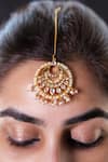 Buy_Vasundhara_Gold Plated Nivriti Rhodium Maangtikka _at_Aza_Fashions