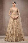 Buy_Tarun Tahiliani_Gold Tulle, Net Sequins, Embroidery Round Neck Embellished Lehenga Set _at_Aza_Fashions