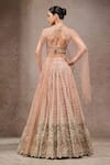 Shop_Tarun Tahiliani_Ivory Tulle, Net Sequins, Beads Round Neck Ivory-gold Lehenga Set _at_Aza_Fashions