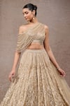 Shop_Tarun Tahiliani_Gold Tulle, Net Sequins, Beads Off-shoulder Embroidered Lehenga Set _Online_at_Aza_Fashions