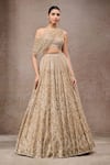 Tarun Tahiliani_Gold Tulle, Net Sequins, Beads Off-shoulder Embroidered Lehenga Set _at_Aza_Fashions