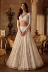 Seema Gujral_Ivory Net Tassels, Pearls, Sequins Plunge Neck Floral Lehenga Set _Online_at_Aza_Fashions