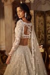 Shop_Seema Gujral_Ivory Net Tassels, Pearls, Sequins Plunge Neck Floral Lehenga Set _at_Aza_Fashions