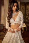 Buy_Seema Gujral_Ivory Net Tassels, Pearls, Sequins Plunge Neck Floral Lehenga Set _Online_at_Aza_Fashions