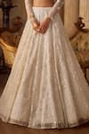 Shop_Seema Gujral_Ivory Net Tassels, Pearls, Sequins Plunge Neck Floral Lehenga Set _Online_at_Aza_Fashions
