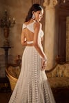 Shop_Seema Gujral_Beige Net Pearls, Sequins, Tassels Plunge Neck Champagne Fishcut Lehenga Set _at_Aza_Fashions
