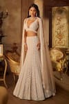 Buy_Seema Gujral_Beige Net Pearls, Sequins, Tassels Plunge Neck Champagne Fishcut Lehenga Set _at_Aza_Fashions