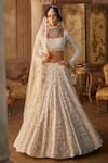 Buy_Seema Gujral_Beige Net Pearls, Tassels, Crystals Sweetheart Neck Embroidered Lehenga Set _at_Aza_Fashions