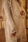 Buy_Seema Gujral_Ivory Net Pearls, Tassels Round Neck Floral Embroidered Sharara Set _Online_at_Aza_Fashions