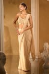 Aariyana Couture_Gold Crepe Sequins, Embroidery Sweetheart Neck, Pre-draped Saree With Blouse _at_Aza_Fashions