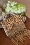 Bhavna Kumar Gold Crystals, Tassels Embellished Boho Clutch Online at Aza Fashions Bhavna Kumar_Gold Crystals, Tassels Embellished Boho Clutch_Online_at_Aza_Fashions