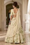Shop_Paulmi And Harsh_Ivory Organza, Shantoon Embroidery, Tassels V-neck Printed Lehenga Set _at_Aza_Fashions