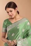 Shop_Samyukta Singhania_Green Embroidery, Zari V-neck Woven Banarasi Silk Saree With Blouse _Online_at_Aza_Fashions