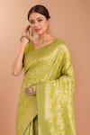 Samyukta Singhania_Green Tassels, Zari V-neck Woven Banarasi Silk Saree With Blouse _at_Aza_Fashions