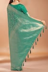 Shop_Samyukta Singhania_Turquoise Tassels, Zari V-neck Woven Banarasi Silk Saree With Blouse _at_Aza_Fashions