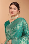 Samyukta Singhania_Turquoise Tassels, Zari V-neck Woven Banarasi Silk Saree With Blouse _Online_at_Aza_Fashions